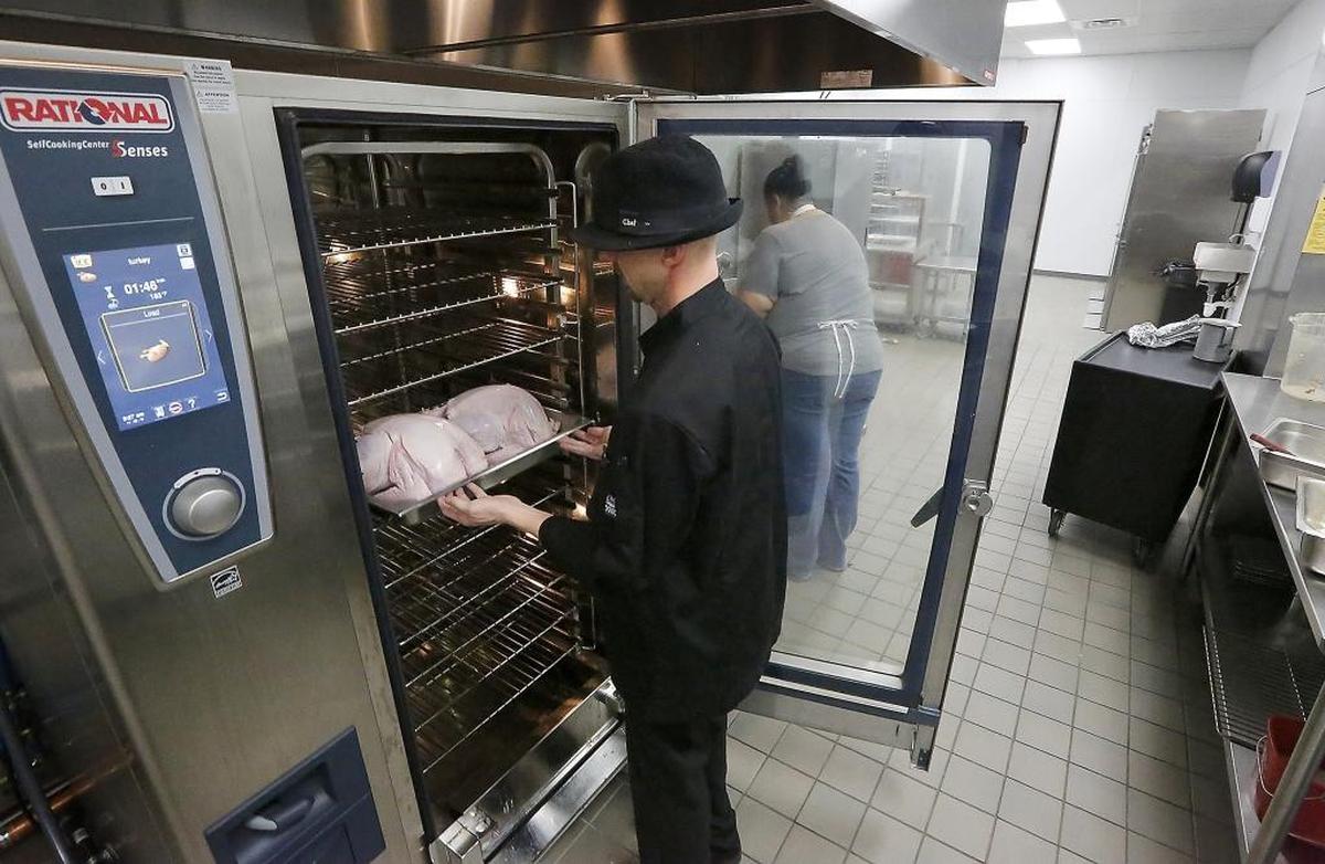 A staffer works in the new Mid-Columbia Meals on Wheels kitchen on Fowler Street in this file photo.