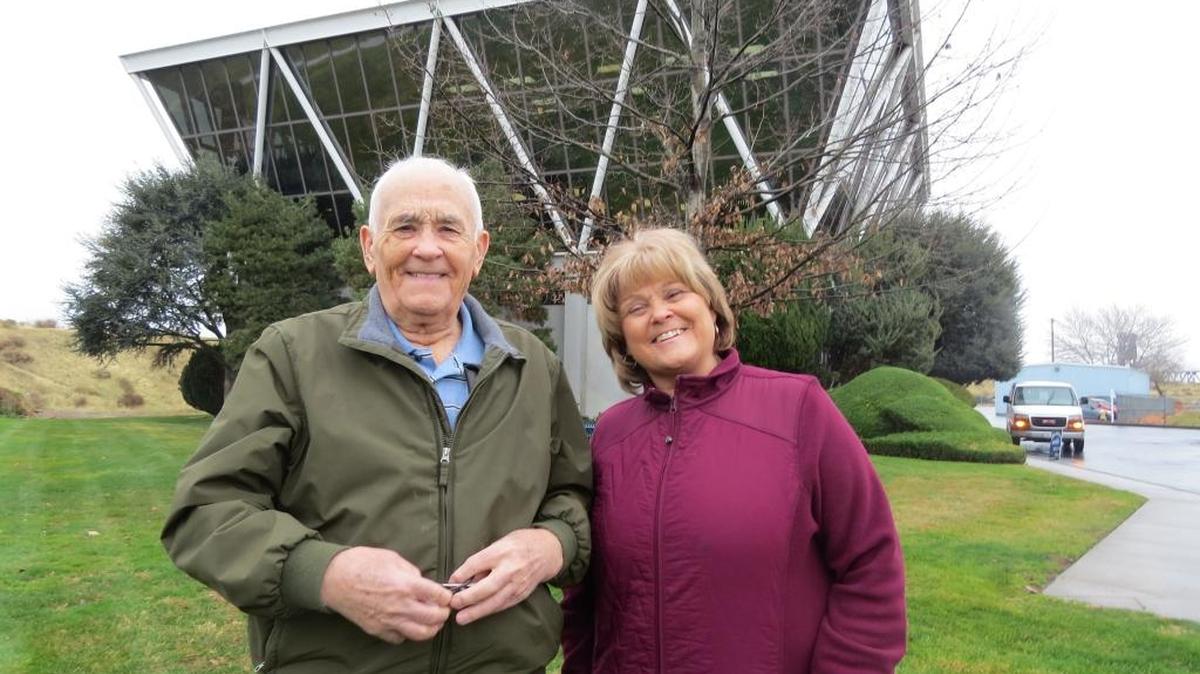Jim Legard stands with his daughter Debi Kreider at the Lampson Crane building in Kennewick on Friday. They plan to participate in their third run on Saturday