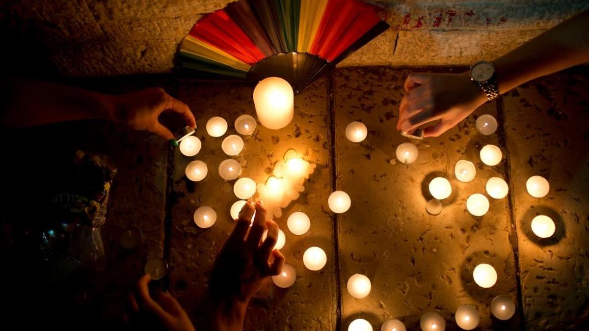 Members of the LGBT community light candles in solidarity with Florida's shooting attack victims, in Tel Aviv, Israel, on Sunday. The shooting attack in Orlando left more than 50 people dead amid a multitude of events celebrating LGBT Pride Month.