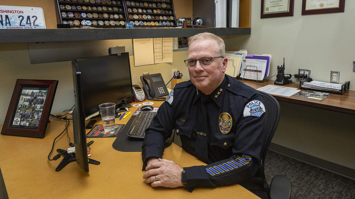 Chief of Police, Ken Roske sits inside his office at his desk at the Pasco Police Department. 