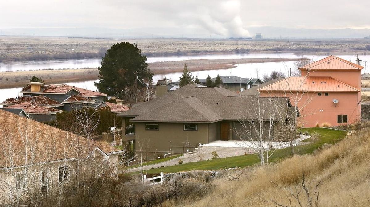Benton and Franklin county emergency managers say a false emergency alert like the one that recently panicked Hawaiians is unlikely in the Mid-Columbia, but not impossible. Residents and people near the Columbia and Yakima rivers near Hanford receive scheduled tests of the alerts. The Columbia Generating Station nuclear power plant can be seen on the Hanford site across the Columbia River from these Franklin County homes.