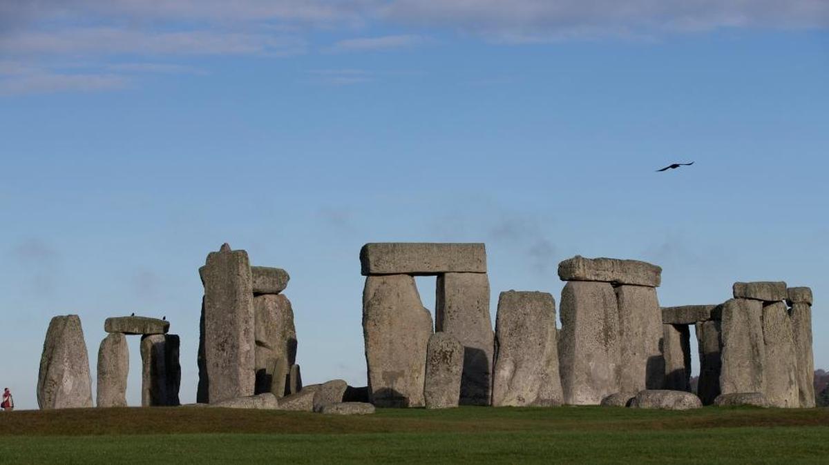 Visitors take photographs of the world heritage site of Stonehenge, England. It has been standing for thousands of years, so Britain’s ancient Stonehenge monument was due a makeover. The $44 million renovation, which was previewed last week includes a new building 1.5 miles from the stones where the 1 million a year visitors can watch an exhibition about Neolithic life.