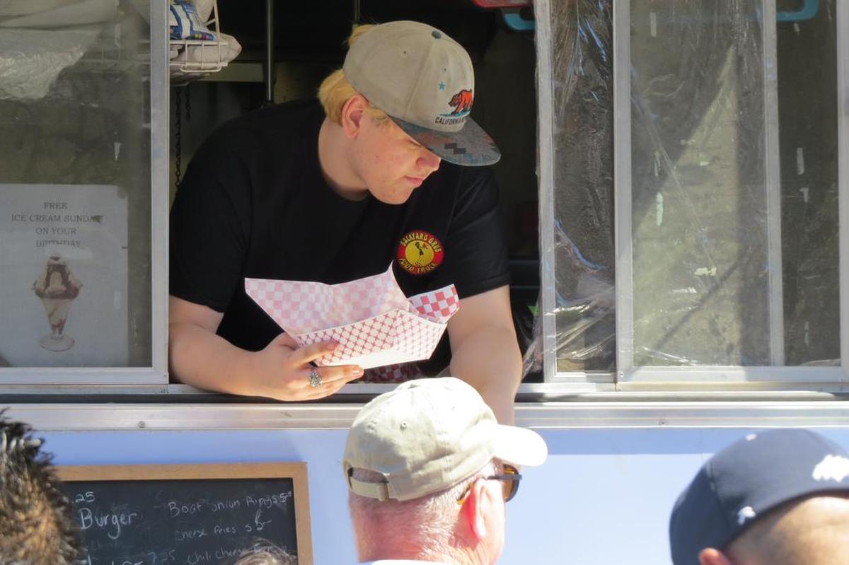 Tri-Citians line up for lunch at Pasco’s Food Truck Friday event. A new law in Washington requires all mobile food trucks to have a state permit and inspection.