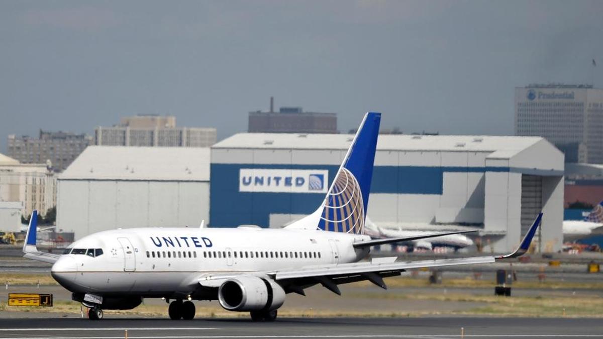 In this Sept. 8, 2015, photo, a United Airlines passenger plane lands at Newark Liberty International Airport in Newark, N.J. Twitter users are poking fun at United's tactics in having a man removed from an overbooked Chicago to Louisville flight on April 9, 2017.