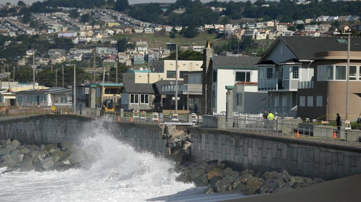 Waves crash near a damaged section of seawall in Pacifica, Calif. Living along the ocean has its benefits, but the swelling ocean may threaten the homes of up to 13.1 million coast-dwelling Americans by the end of this century, according to the study published Monday in the journal Nature Climate Change.