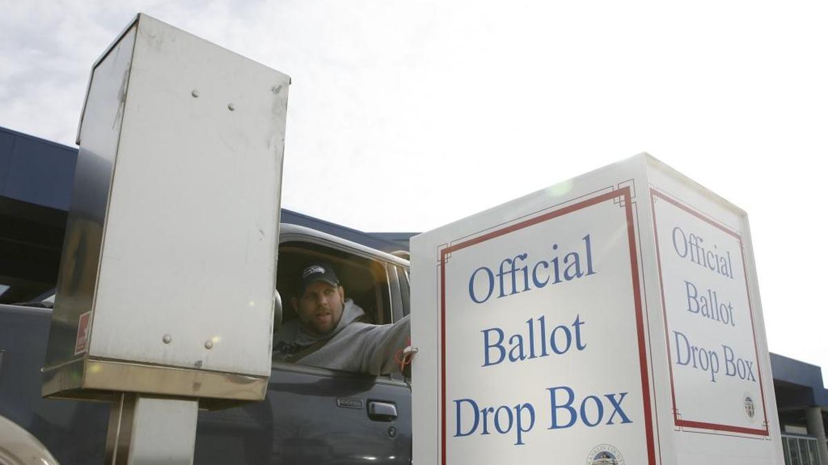 Jeremy Shepard of Pasco drops off a ballot in 2013 at the TRAC in Pasco.