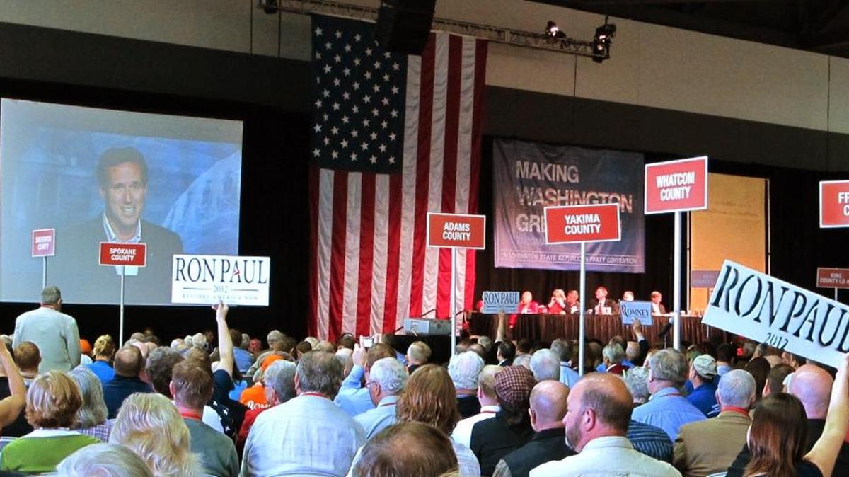 Washington state Republicans listen to a video speech by former presidential candidate Rick Santorum during the 2012 state convention in Tacoma. Pasco hosts the 2016 GOP state convention. State officials say if there’s no clear candidate by then, the Washington gathering could take on unexpected national importance. (AP Photo/Rachel La Corte)