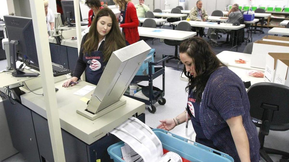 Ashley Heyen, left, Franklin County assistant election administrator, and temporary election worker Shannon Kimball process ballots Nov. 8 at the Franklin County Election Center. Updated numbers were released Wednesday evening.