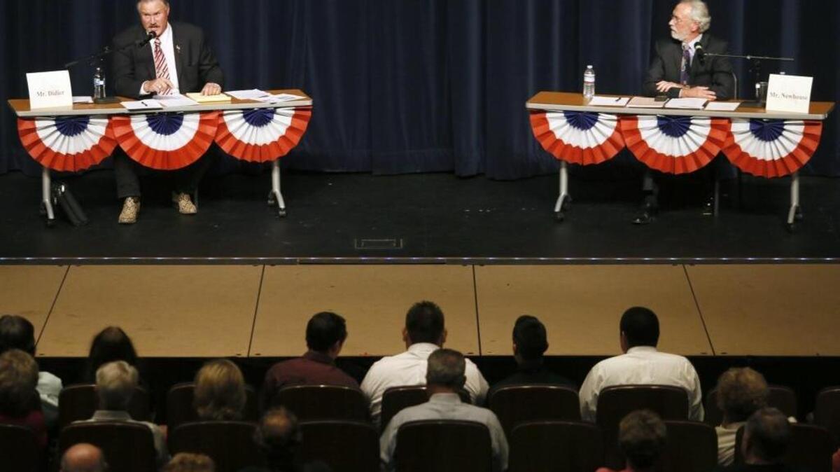 U.S. Rep. Dan Newhouse, R.-Sunnyside, right, will face a rematch against Franklin County Republican Clint Didier in the Nov. 8 general election. Newhouse narrowly defeated Didier in 2014.