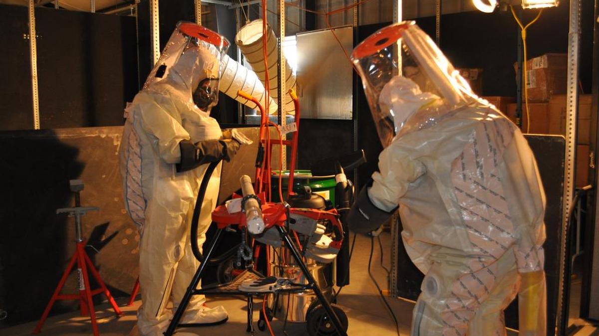 Workers train in fully-encapsulated suites and respirators at HAMMER.