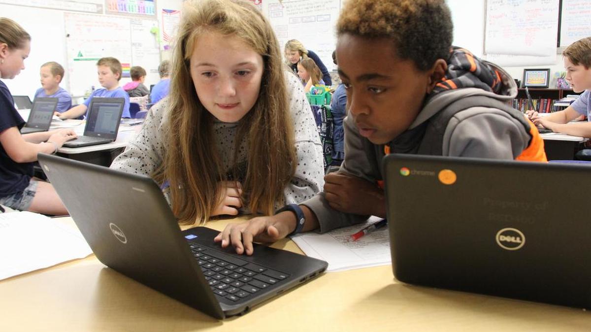 Students at William Wiley Elementary work on a group project using Google Chromebooks provided through the district's 1:1 Technology Initiative.