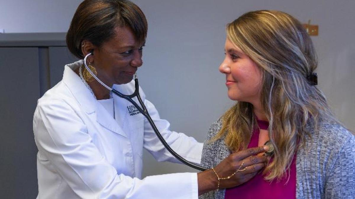 Dr. Denise Algood, Clinic Director, examines a patient as part of our medical surveillance program.