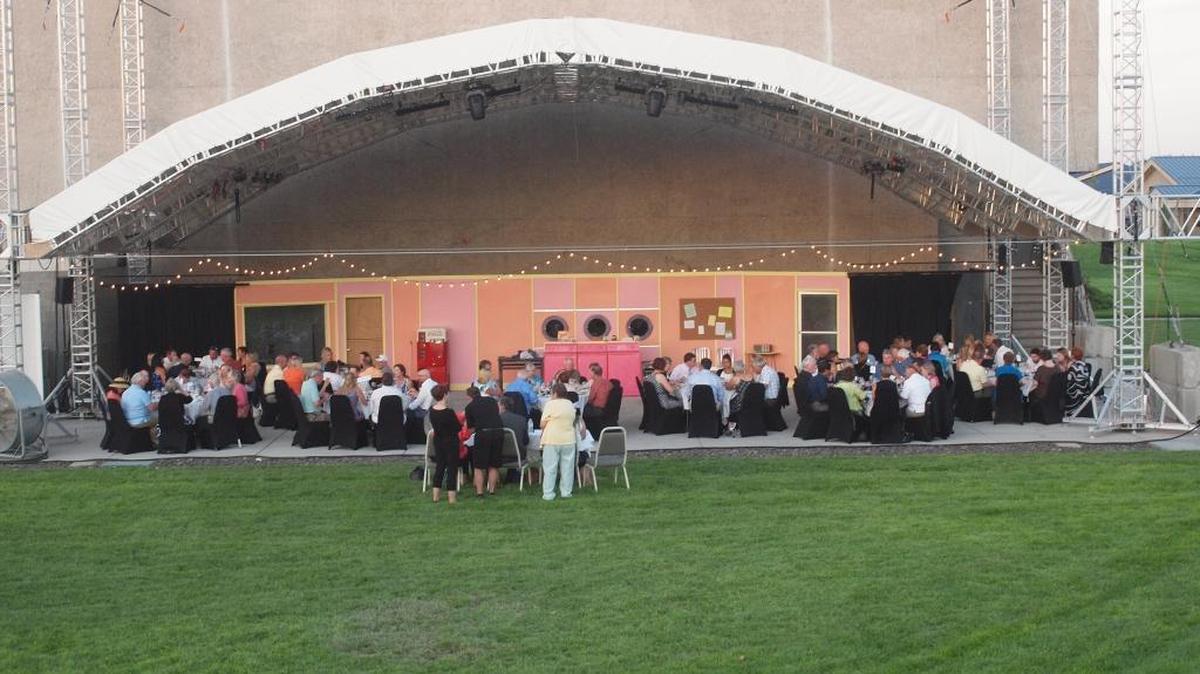 Opening night patrons enjoy the first course of dinner theatre under the Diane C. Hoch stage.