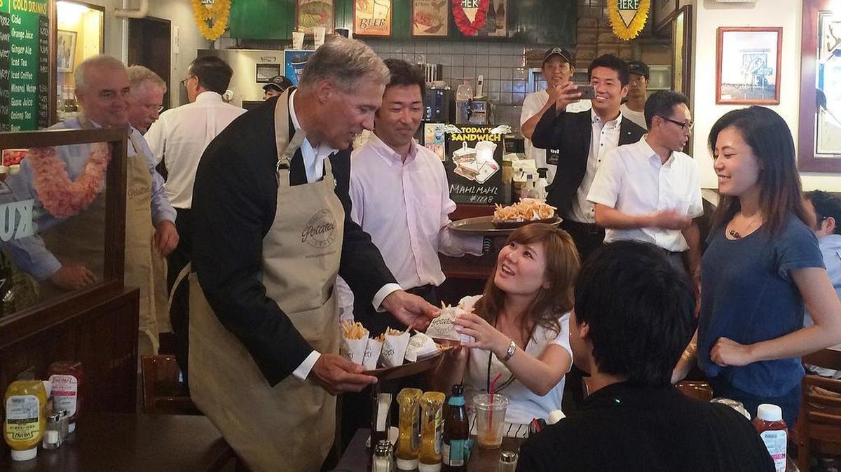 Gov. Jay Inslee created quite a buzz as he served french fries during a trade mission stop last year in Tokyo.
