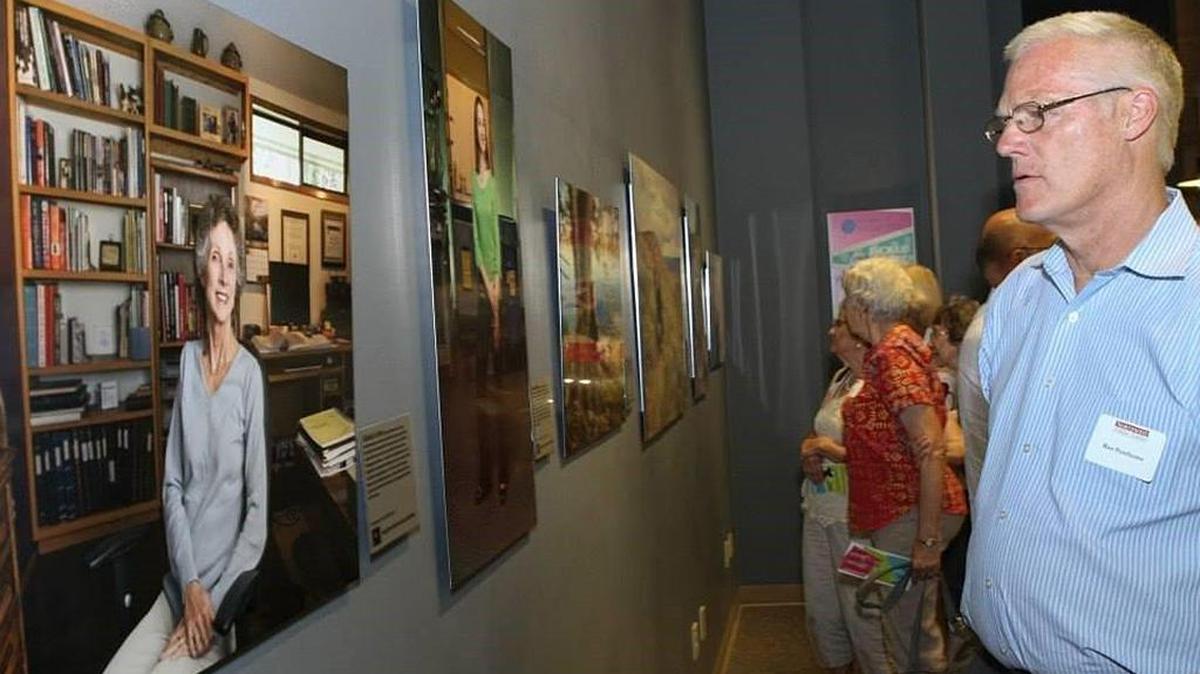 Visitors check out the Daughters of Hanford exhibit at the REACH.