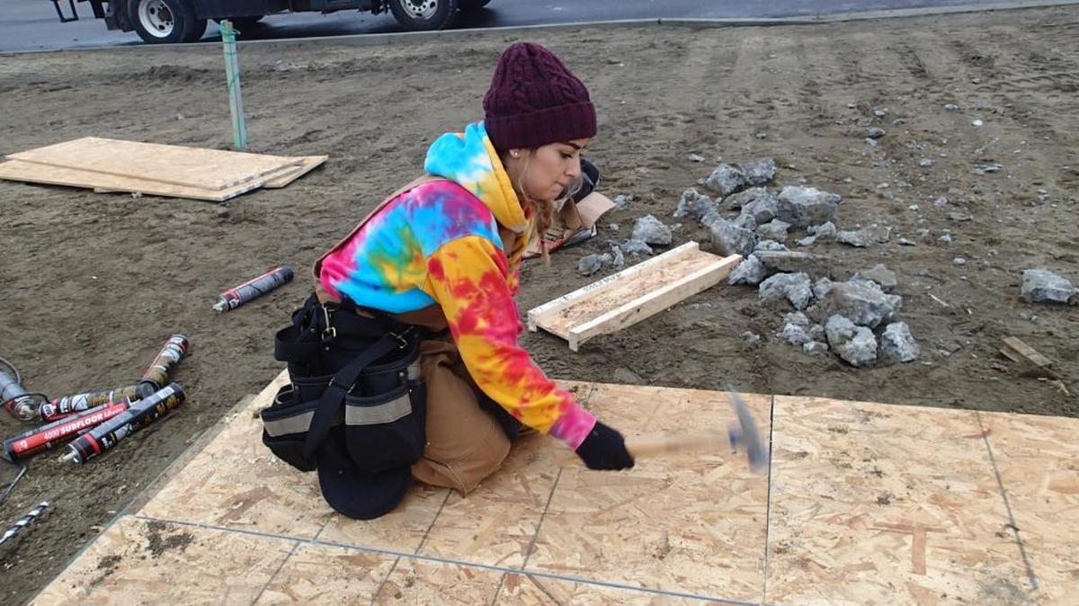 A student from Tri-Tech Skills Center works on a housing project.