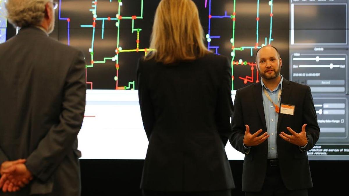 Rep. Dan Newhouse, left, and Deputy Energy Secretary Elizabeth Sherwood-Randall, right, learned about PNNL power grid research from PNNL’s Jason Fuller while touring the new Systems Engineering Building last summer. In cooperation with the Department of Energy’s Pacific Northwest Site Office, plans for a modern campus include the addition of new laboratories and office space — with new facilities planned at the rate of about one a year for the next decade.