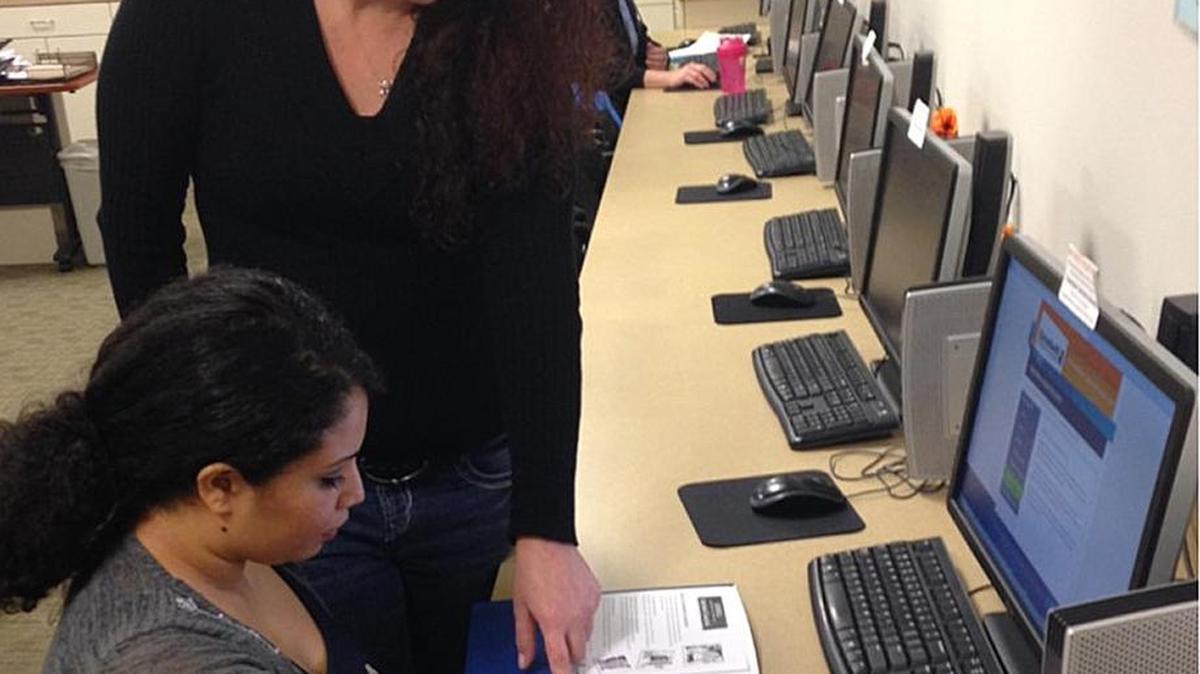 Goodwill Employment Specialist Ginny Nicolls assists a job seeker in the Pasco Employment Connection Center.