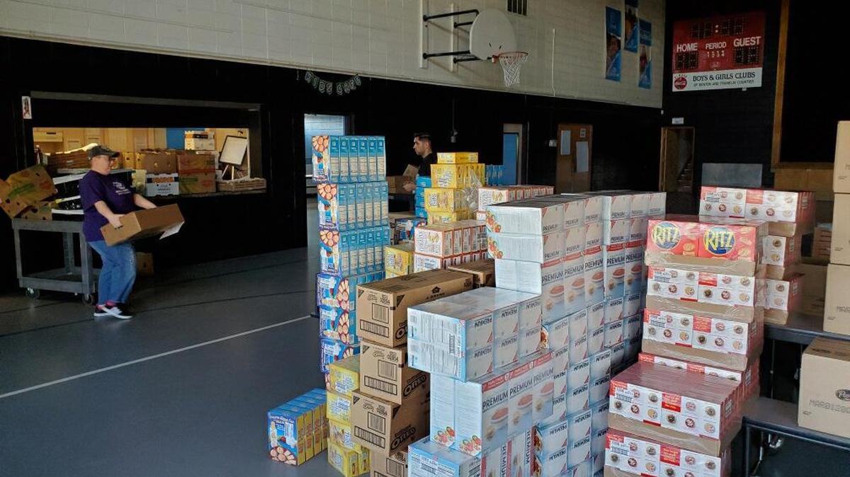 Staff sort food donations.