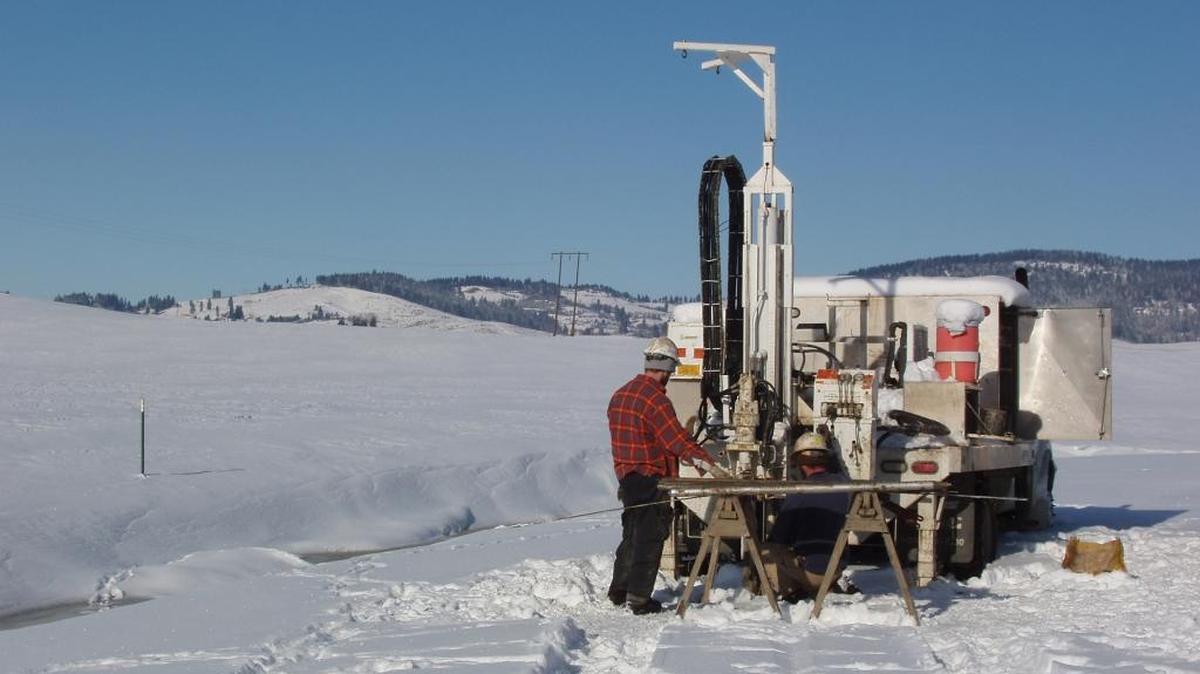 A worker operates a TerraGraphics Drill Rig.