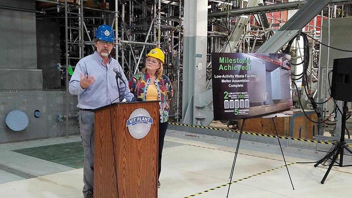 Federal project director Bill Hamel and former Bechtel National, Inc. project director Peggy McCullough announce the assembly of both nuclear melters inside the Waste Treatment and Immobilization Plant’s Low-Activity Waste Facility at an event last fall. The melters are the most complex pieces of equipment for the LAW facility, which is on track to be finished with construction in June 2018.