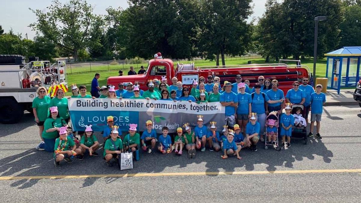 Lourdes Health and Trios Health work together during a recent parade.