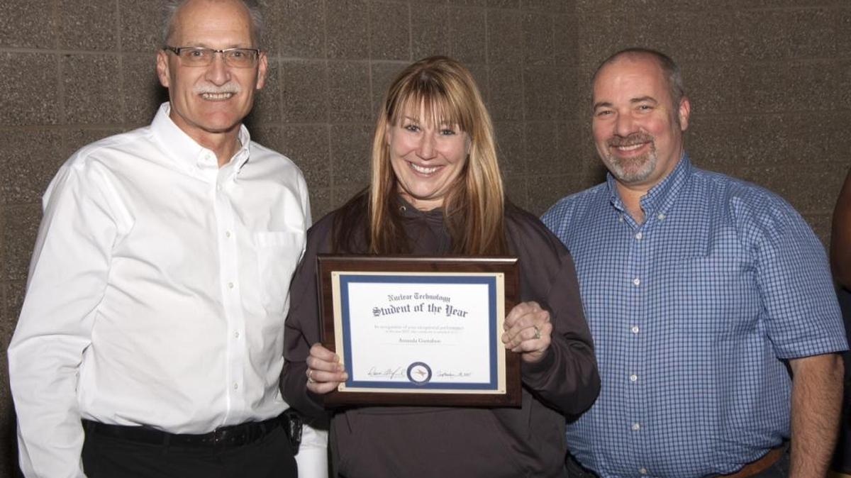 From left, Dave McCormack, Dade Moeller president and nuclear technology advisory committee member; Amanda Gustafson, student of the year; and Lloyd Keith, Washington River Protection Solutions HPI program manager and CBC nuclear technology adjunct instructor at the CBC Nuclear Technology Ceremony.
