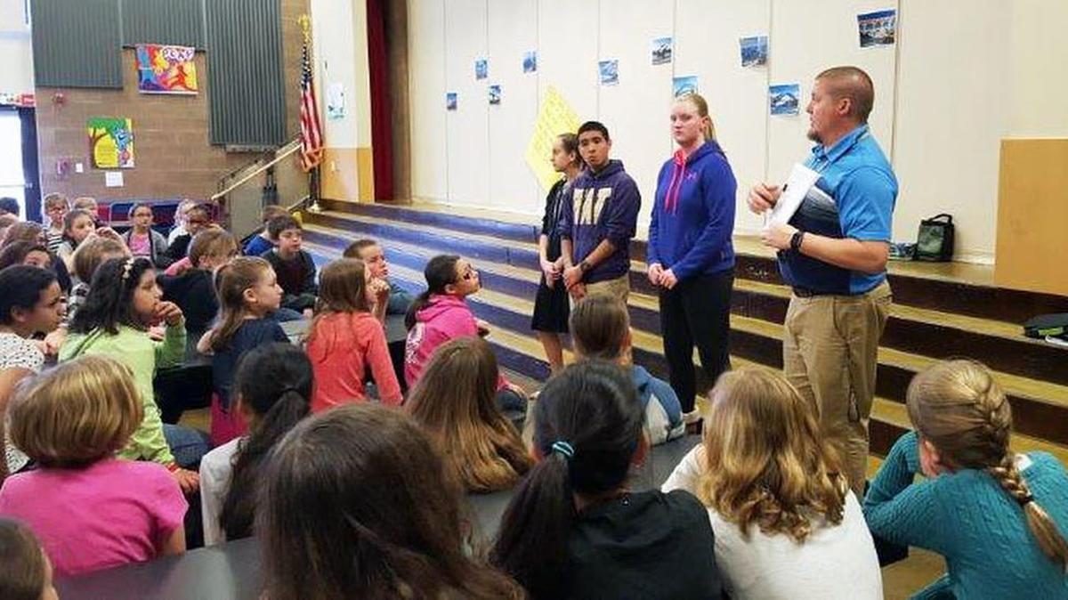 Chief Joseph Middle School eighth-grade AVID students Jasmine Urban, Edward De La Paz and Avery Moses, along with assistant principal Kevin Norris, help Jason Lee Elementary students understand how AVID will help them with organization, critical thinking, self-management and academic skills.