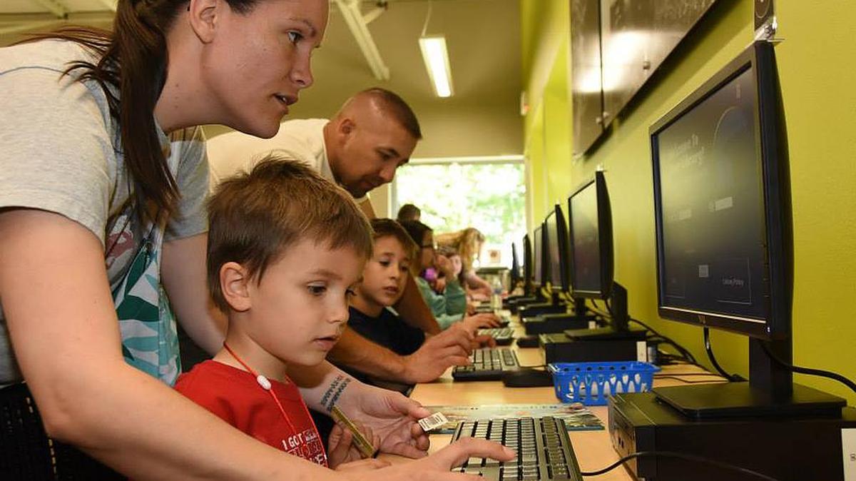 Visitors enjoy the new computer stations at the Prosser branch of the Mid-Columbia Libraries.