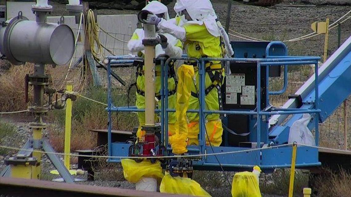 Workers at the Hanford Site made final connections between a pipe sticking up out of one of three aging underground structures being stabilized and a grout delivery system.