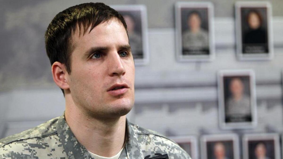 In this April 8, 2010 photo, Capt. Scott Smiley gives a tour of his staff's offices in West Point, N.Y.