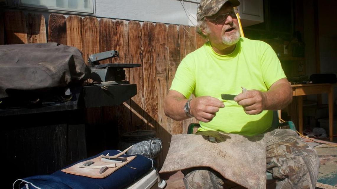 Flintknapper Steve Gobbel fashions an arrowhead out of obsidian at his home in Twin Falls, Idaho.