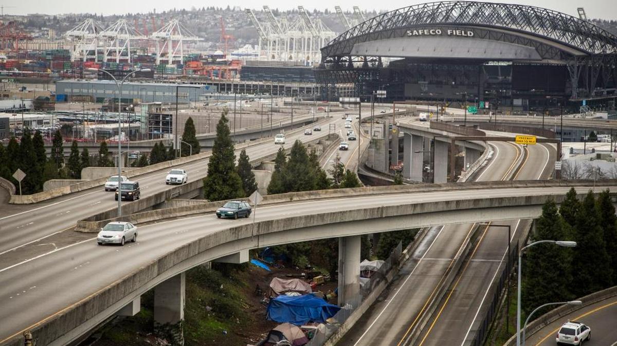The sprawling encampment under a Interstate 5 in Seattle, known as The Jungle, has become harder for residents to ignore as conditions deteriorate.