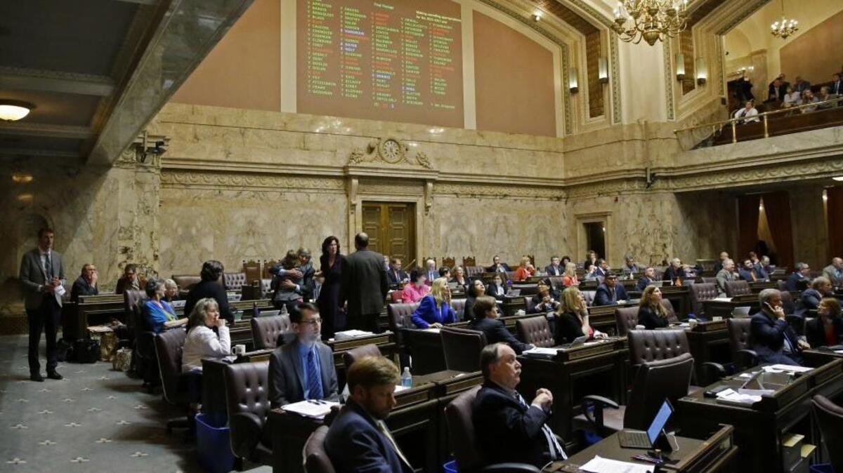Voting results are projected above the House floor June 30 after a vote on the state operating budget at the Capitol in Olympia.