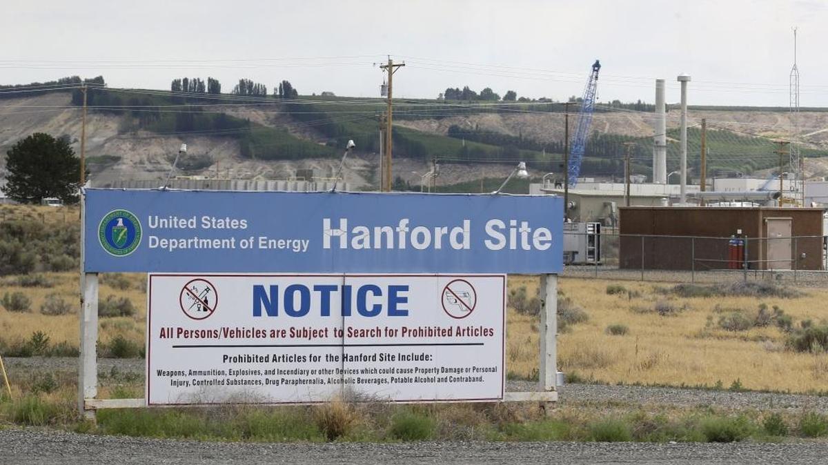 FILE - In this July 9, 2014 file photo, a sign informs visitors of prohibited items on the Hanford Nuclear Reservation near Richland, Wash. An emergency has been declared Tuesday, May 9, 2017, at the Hanford Nuclear Reservation after a portion of a tunnel that contained rail cars full of nuclear waste collapsed. Randy Bradbury, a spokesman for the Washington state Department of Ecology, said officials detected no release of radiation and no workers were injured.   (AP Photo/Ted S. Warren, File)