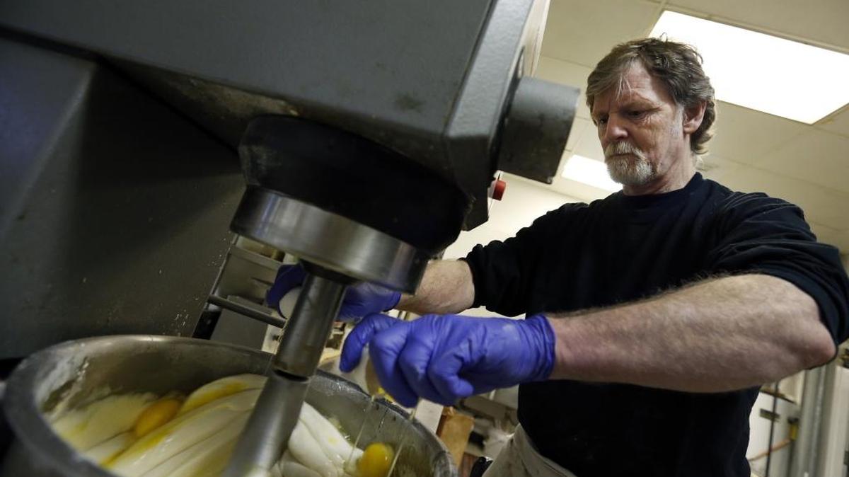Masterpiece Cakeshop owner Jack Phillips cracks eggs into a cake batter mixer in 2014 inside his store in Lakewood, Colo. U.S. Supreme Court justices will hear arguments Dec. 5 on whether a baker who objects to same-sex marriage on religious grounds can refuse to make a wedding cake for a gay couple.