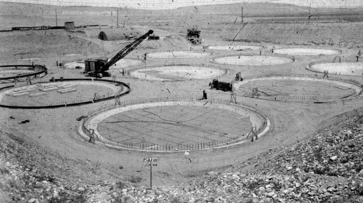 FILE - This 1944 photo provided by the U.S. Department of Energy shows the construction of a “tank farm” to store nuclear waste at the Hanford Site near Richland, Wash. Sean Sullivan, chairman of the Defense Nuclear Facilities Safety Board, has encouraged the elimination of the independent agency that oversees the country’s nuclear defense facilities.