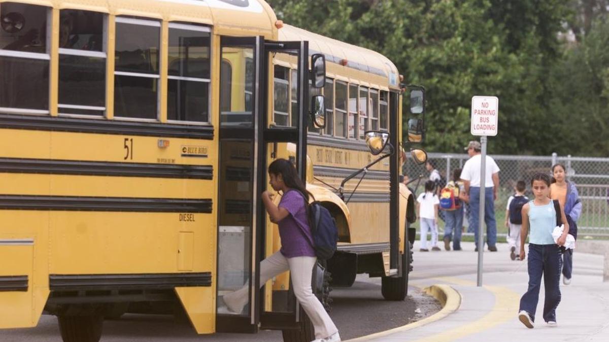 Students board a school bus in Pasco.