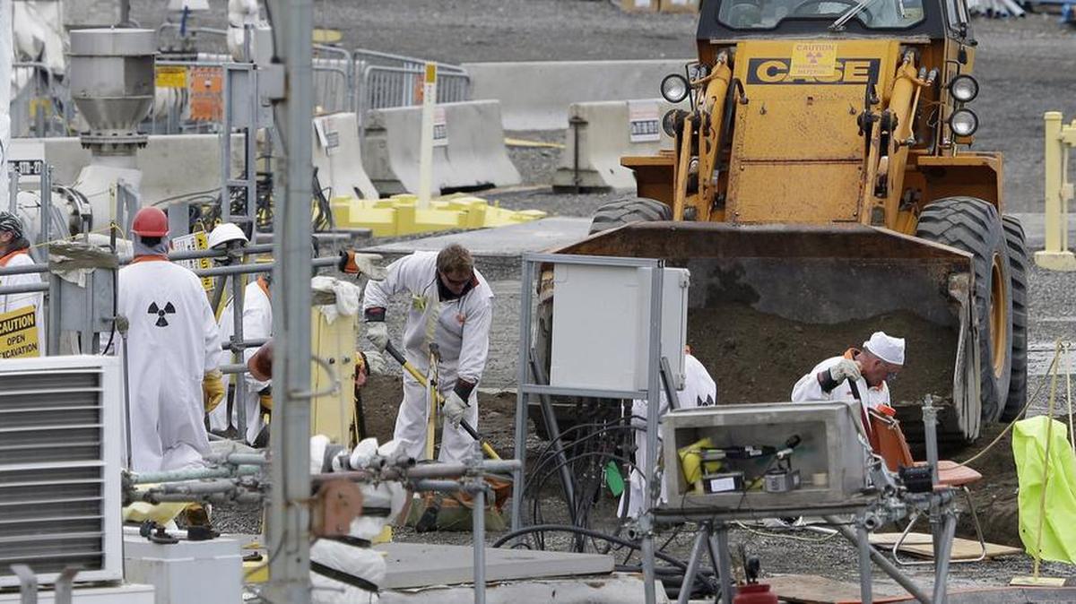 In this photo from March 6, 2013, workers labor at the C Tank Farm at the Hanford Nuclear Reservation, near Richland.