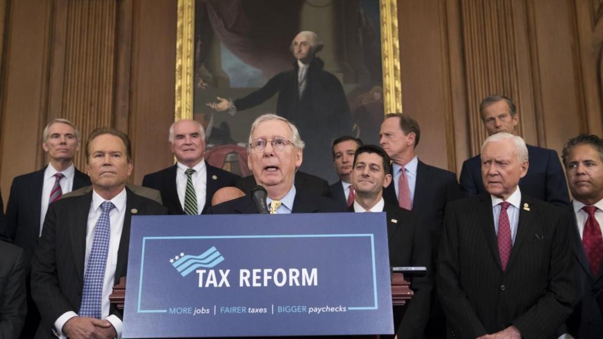 This Sept. 27, 2017 file photo shows Senate Majority Leader Mitch McConnell, R-Ky., center, joining Speaker of the House Paul Ryan, R-Wis., and other GOP lawmakers to talk about the Republicans’ proposed rewrite of the tax code for individuals and corporations, at the Capitol in Washington. House and Senate negotiators are rushing to finalize the tax legislation and deliver the promised measure to President Donald Trump before Christmas.