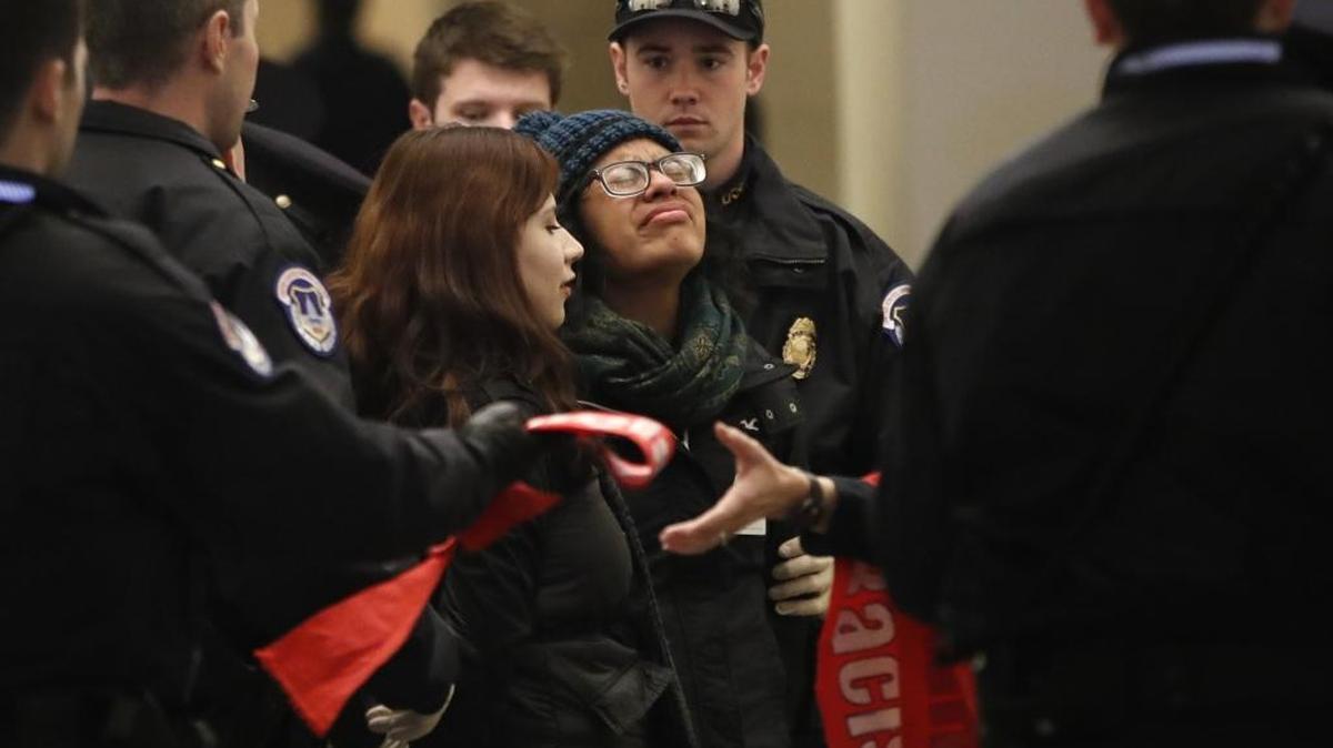 A woman with the Coalition for Humane Immigrant Rights, reacts as she is arrested with other protesters in California outside the office of House Majority Leader Kevin McCarthy of Calif., Jan. 18 Washington, D.C., in favor of the Deferred Action for Childhood Arrivals program.