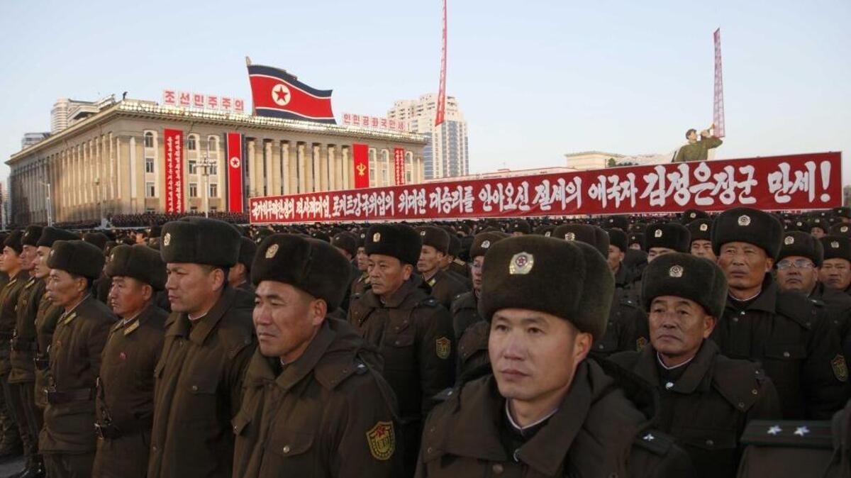 Military personnel gather at Kim Il Sung Square on Dec. 1, in Pyongyang, North Korea. Tens of thousands of North Koreans attended a rally in Pyongyang's central Kim Il Sung Square to make a show of support for the country's latest missile test.