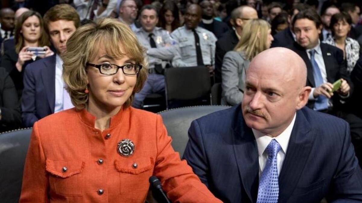 Former Congresswoman Gabrielle Giffords, who was seriously injured in the 2011 mass shooting that killed six people in Tucson, Ariz., arrives at a Senate Judiciary Committee hearing two years later, hand-in-hand with her husband, retired astronaut Mark Kelly, to discuss what lawmakers should do to curb gun violence.
