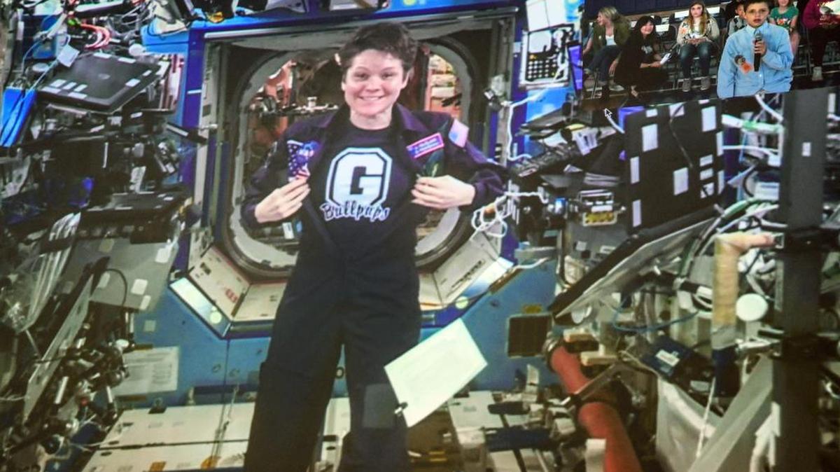 Astronaut Anne McClain displays her Gonzaga Prep Bullpups T-shirt as she participates in an Earth-to-Space video downlink to a gathering of city-wide students at G-Prep, Wednesday, May 15, 2019. The Spokane astronaut returned to earth June 24 after 204 days in space.