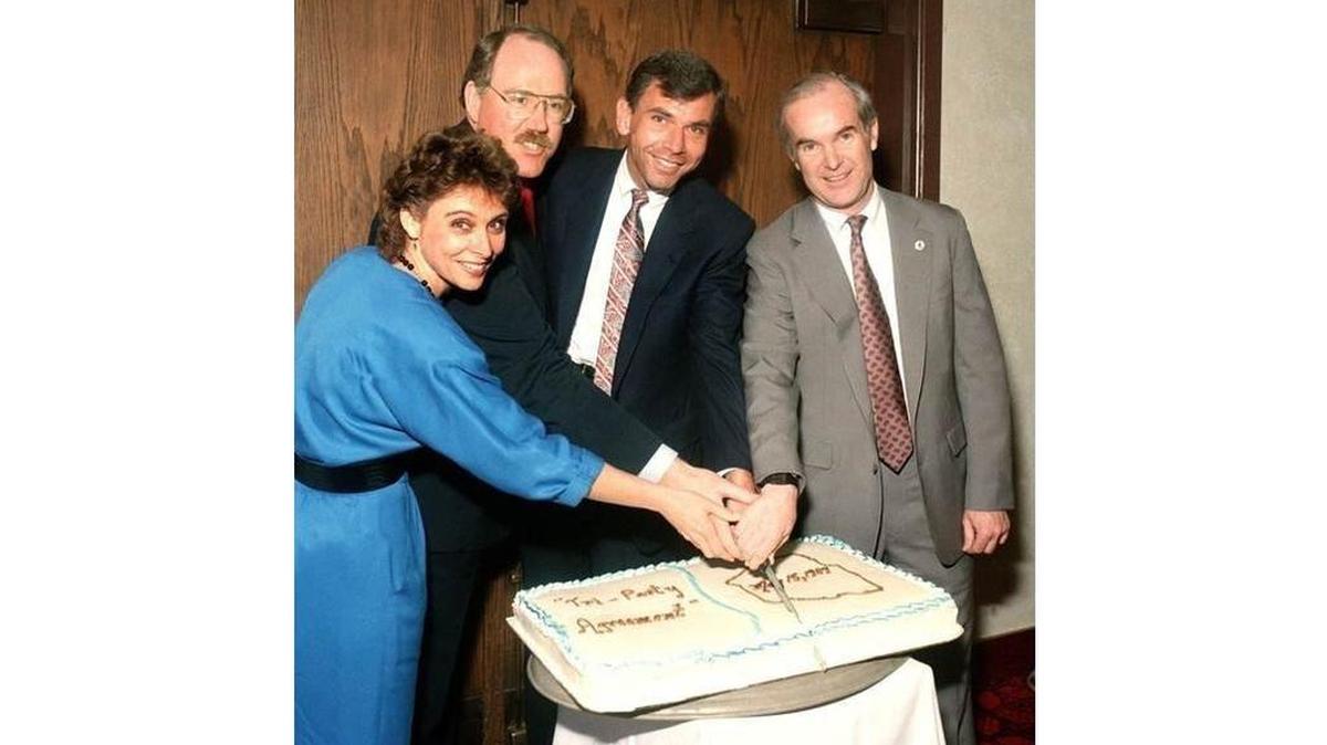 In this 1989 photo, key players celebrate the signing of the Tri-Party Agreement. Washington State Attorney General Chris Gregoire is on the left. Gov. Booth Gardner is on the far right and next to him is Mike Lawrence, manager of the U.S. Department of Energy Richland Operations Office.
