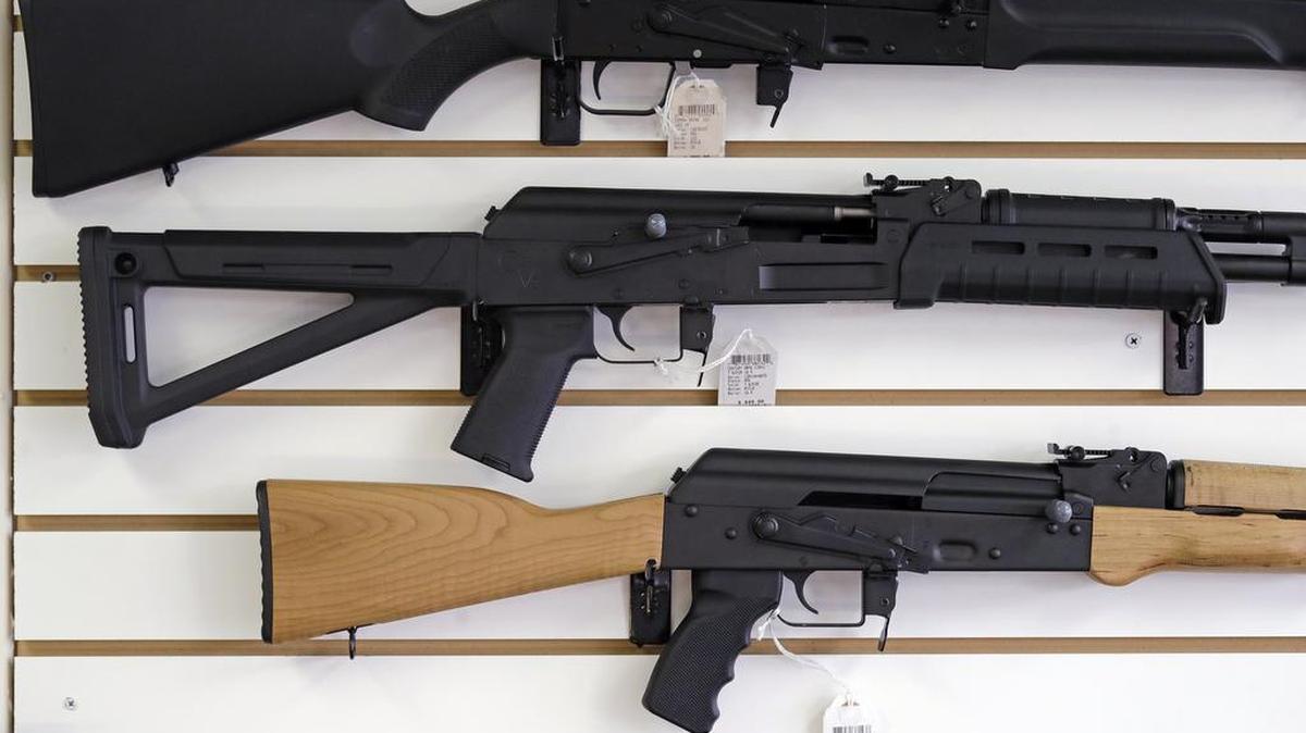 In this Oct. 2, 2018, file photo, semi-automatic rifles are displayed on a wall at a gun shop in Lynnwood, Wash.