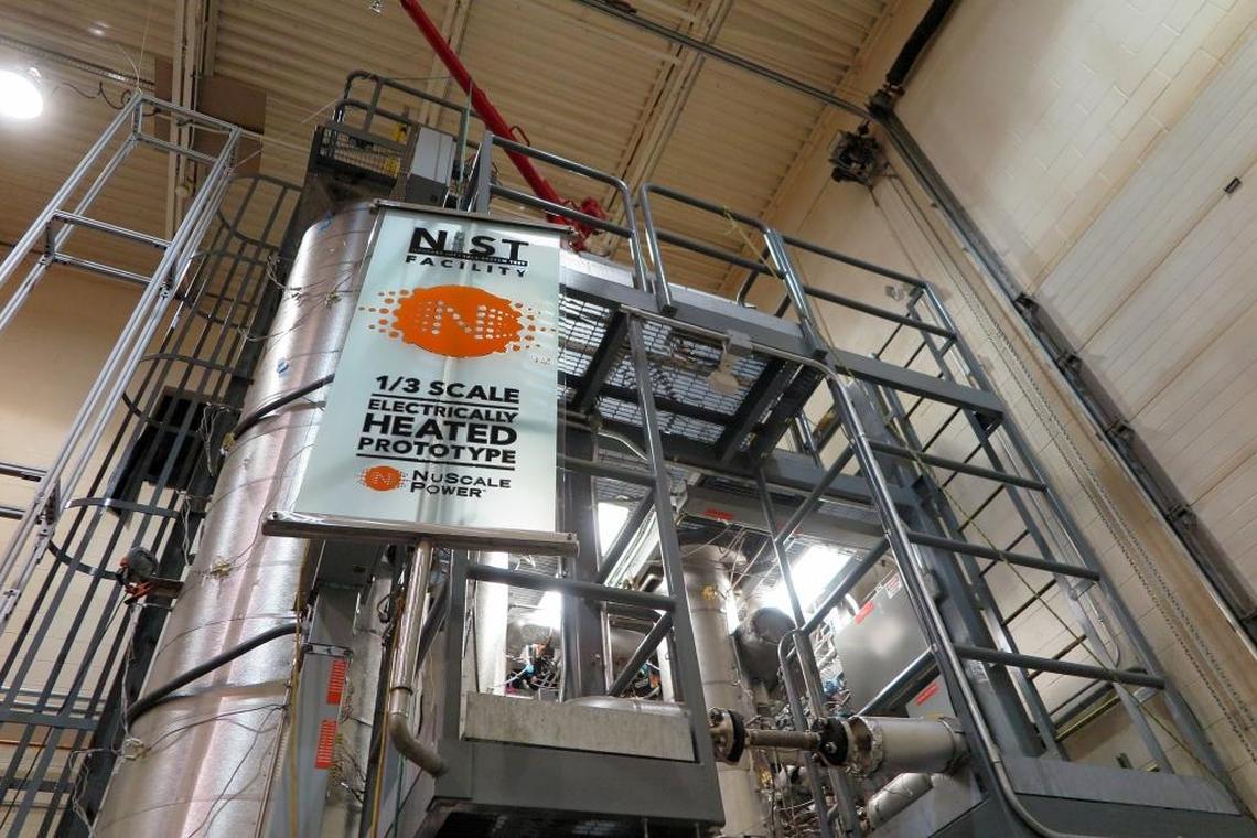 A one-third-scale model Of NuScale Power’s reactor module is perched in a birdcage of steel girders in a nuclear test facility at Oregon State University.