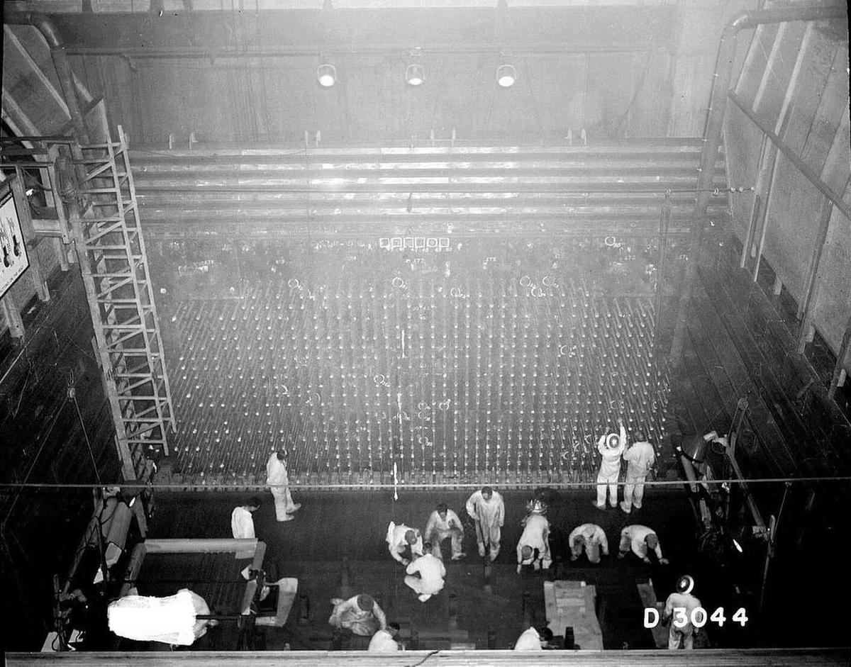 Hanford workers perform various tasks in 1944 at the front face of B Reactor, the world’s first full-scale nuclear reactor.