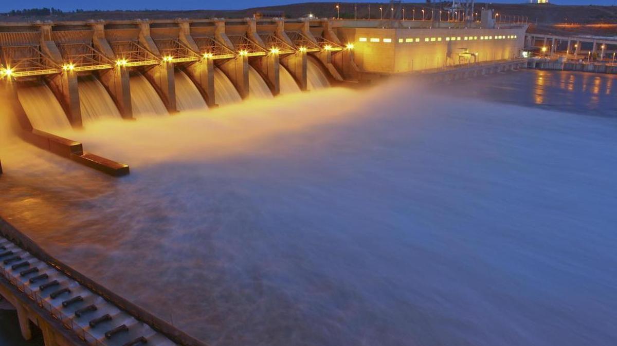 Ice Harbor Dam on the Snake River near Burbank is shown lighted at night.