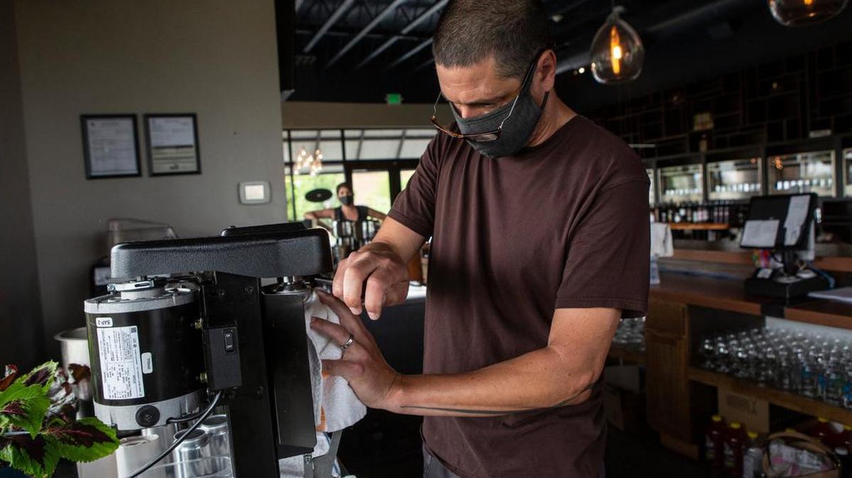 Tri-Cities Tap & Barrel owners Kendra and Jason Sadler are making sure they take all the necessary precautions to keep customers safe including keeping their tap room closed and requiring all customers to wear masks when picking up orders.